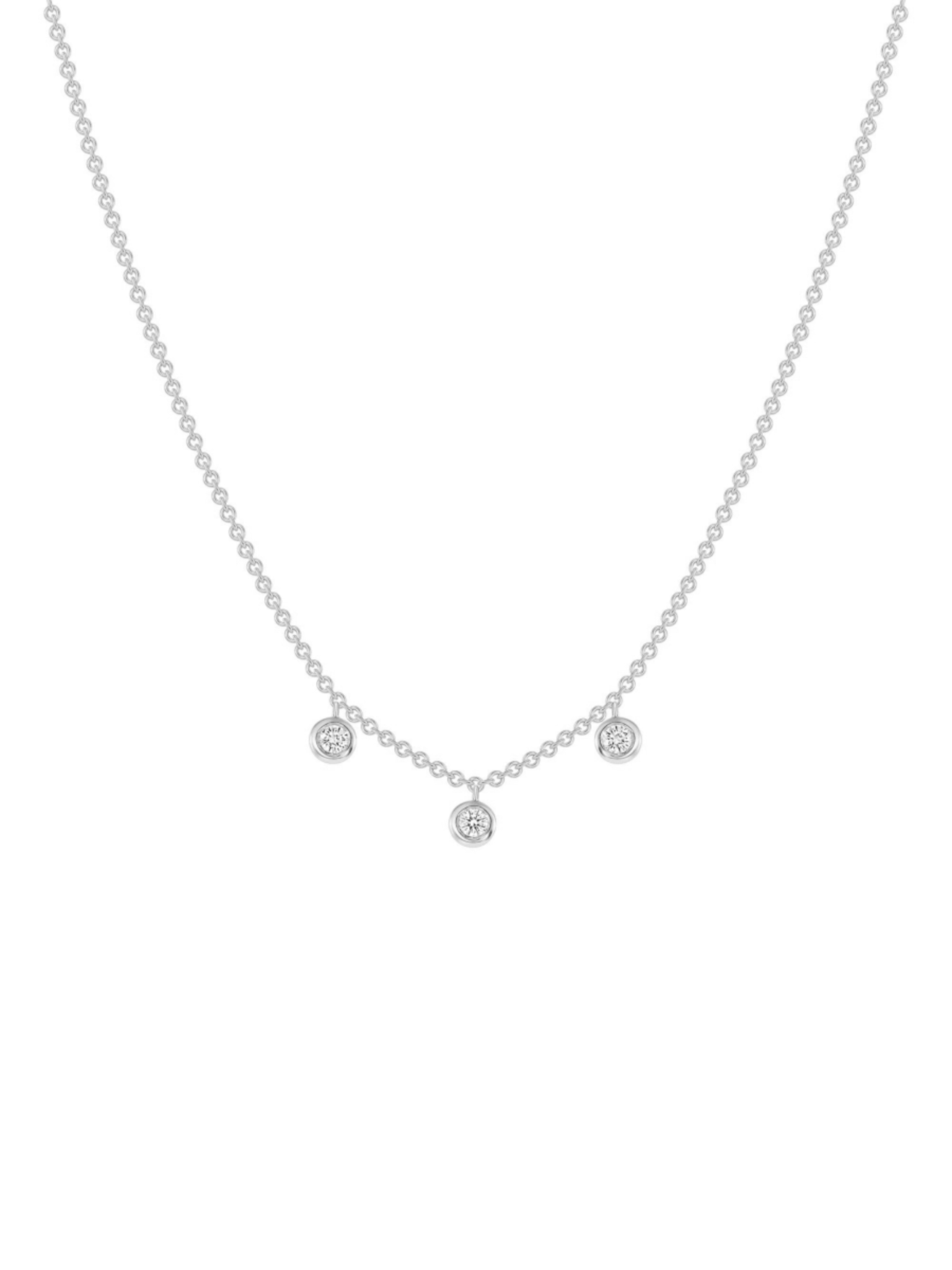 Gold diamond bezel necklace in white gold on a white background