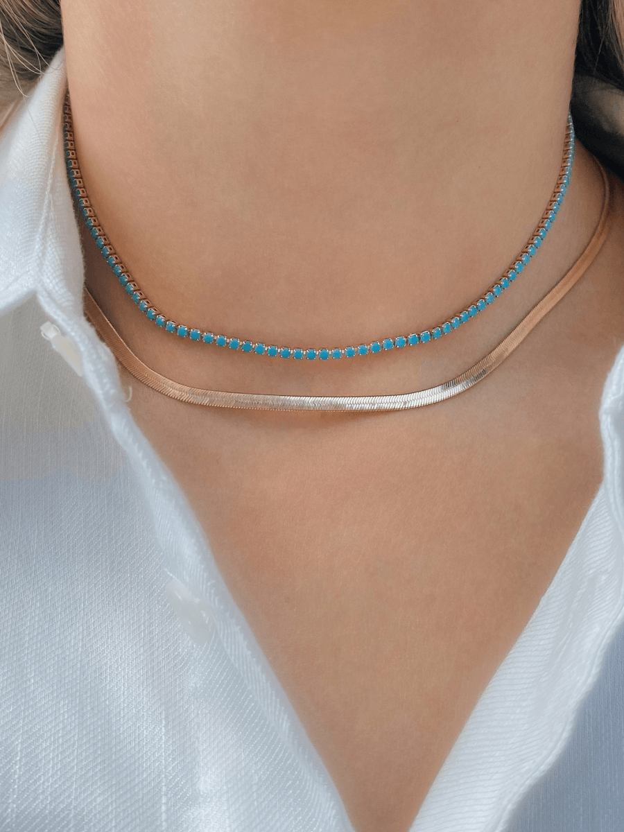 Turquoise CZ choker layered with gold herringbone snake chain